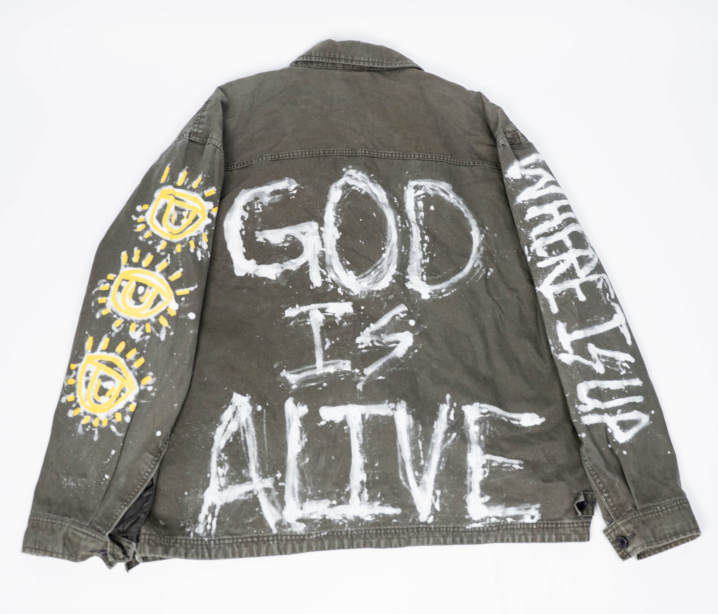 Gray/green jacket with 'God is Alive' and eye designs on a white background