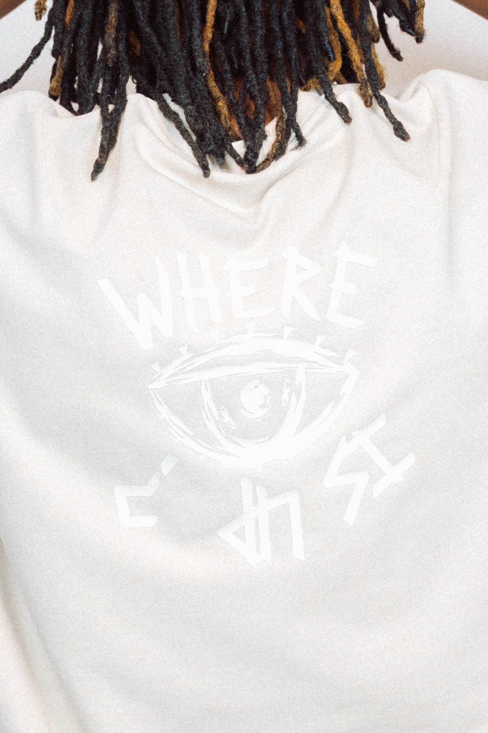 Man wearing limited edition "REVIVAL" Cut -off tee in front of a white background