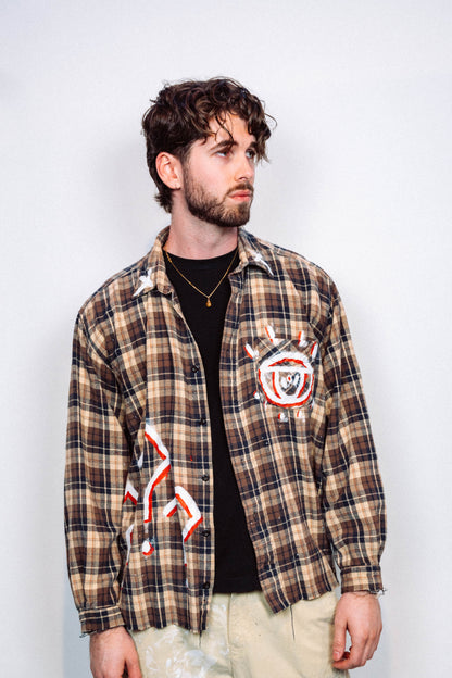 Man wearing a 1 of 1 Hand Painted plaid flannel from luxury wearable art brand "Where Is Up" on a plain background 