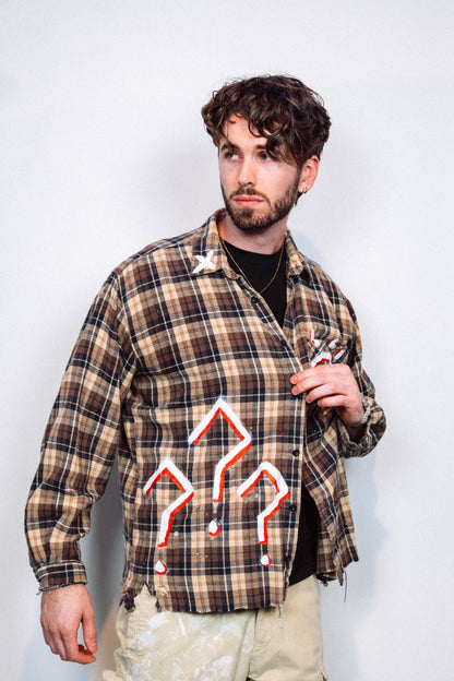 Man wearing a 1 of 1 Hand Painted plaid flannel from luxury wearable art brand "Where Is Up" on a plain background 